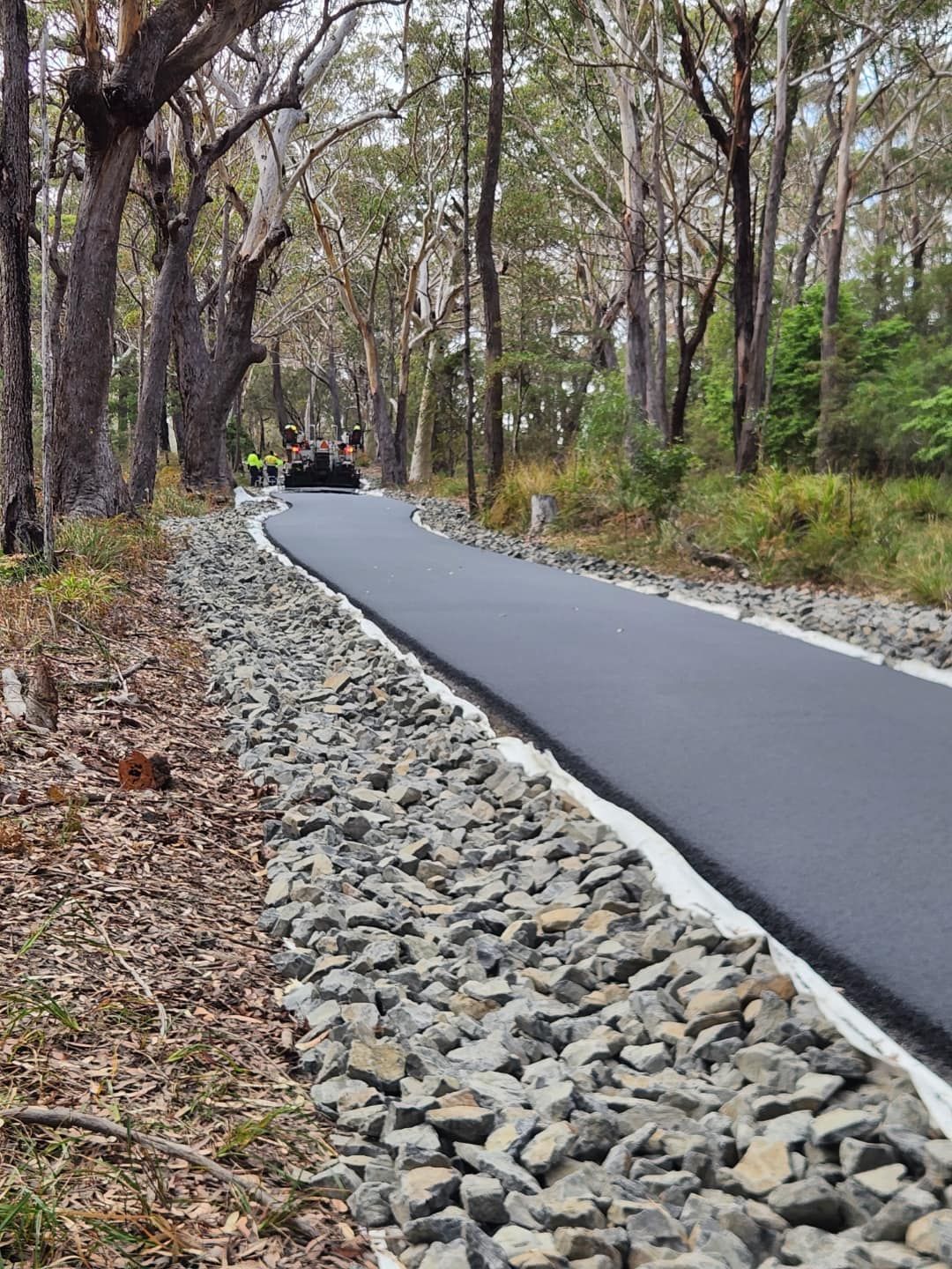 Newly Paved Path Through a Forest With Stone Edging and Trees — ALI Civil Pty Ltd in Ulladulla, NSW