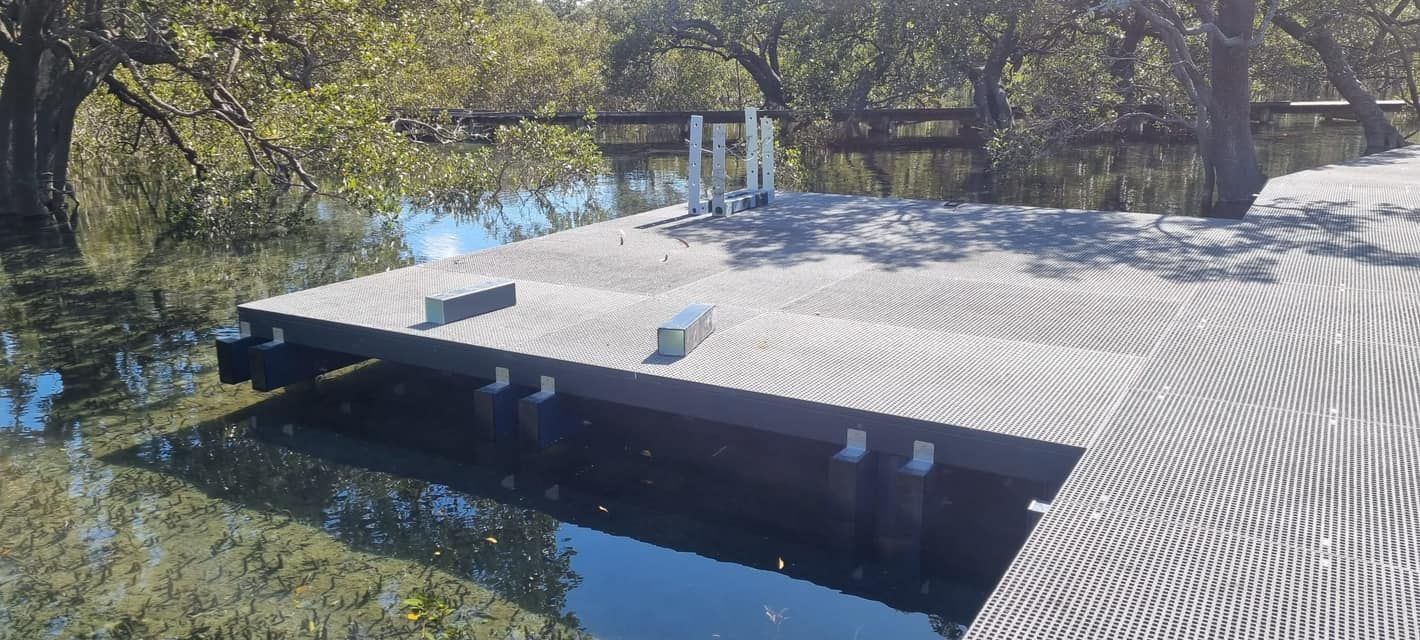 A Flooded Dock Surrounded by Trees and Water — ALI Civil Pty Ltd in Sussex Inlet, NSW
