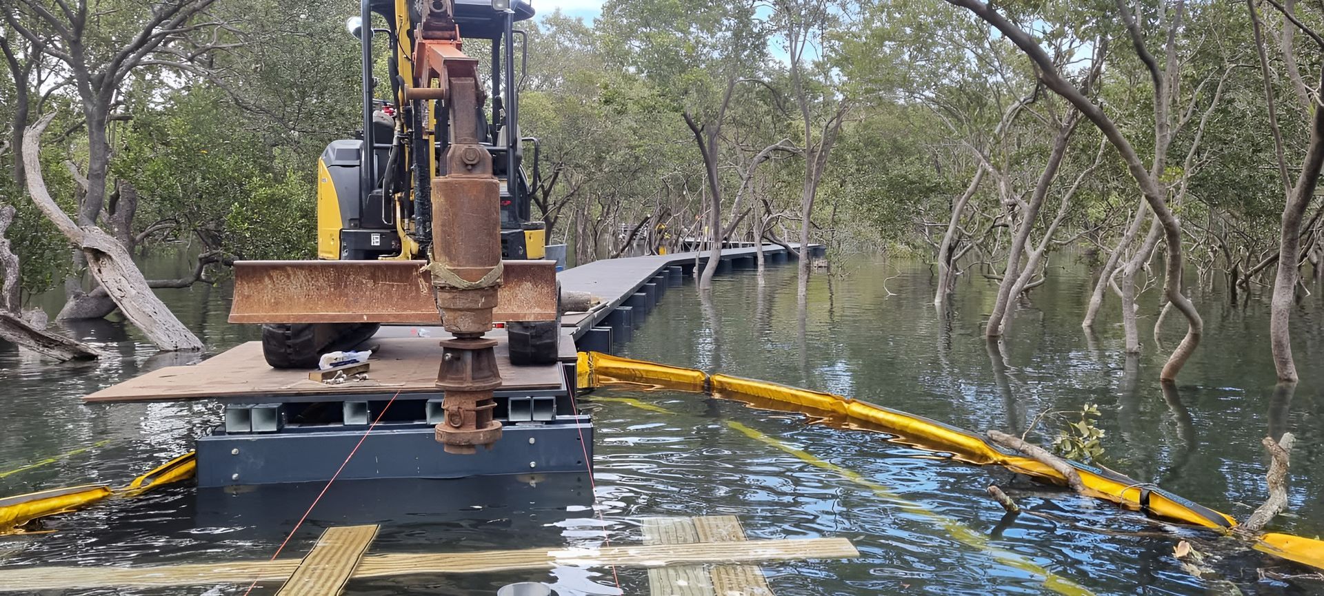 An Excavator Working in a Flooded Mangrove Forest — ALI Civil Pty Ltd in South Nowra, NSW