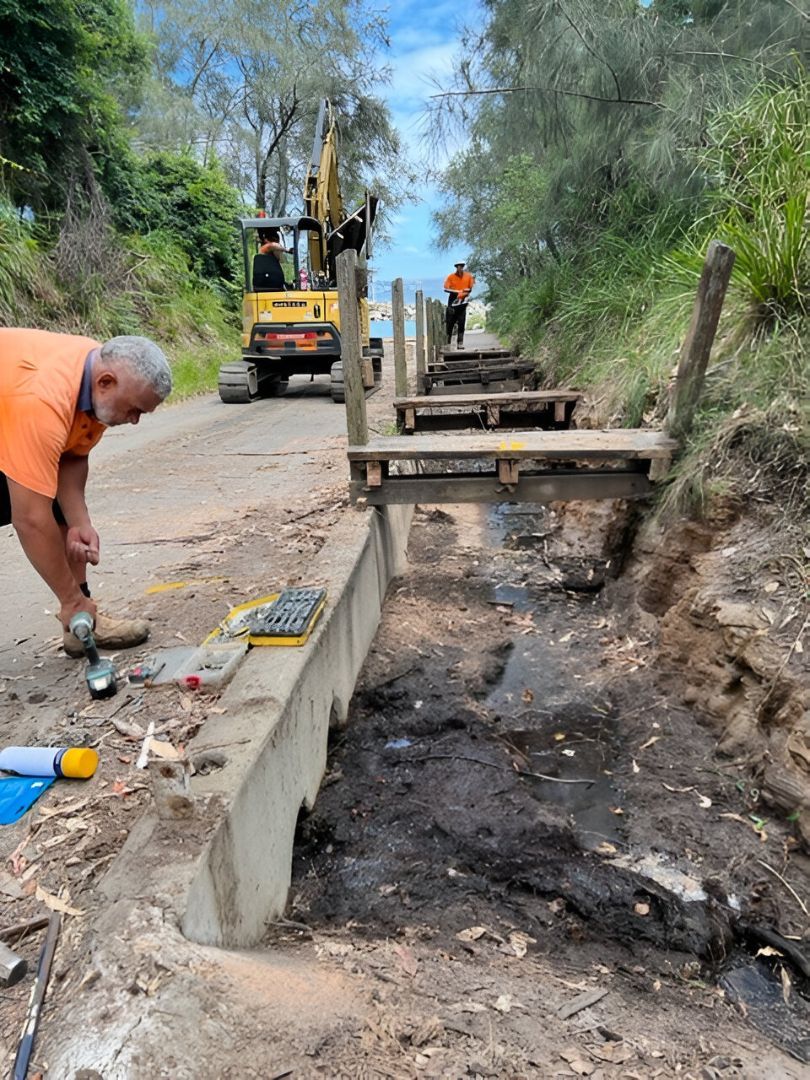 Construction Crew Rebuilding a Drainage Area and Stairs Next to A Road — ALI Civil Pty Ltd in South in Wollongong, NSW
