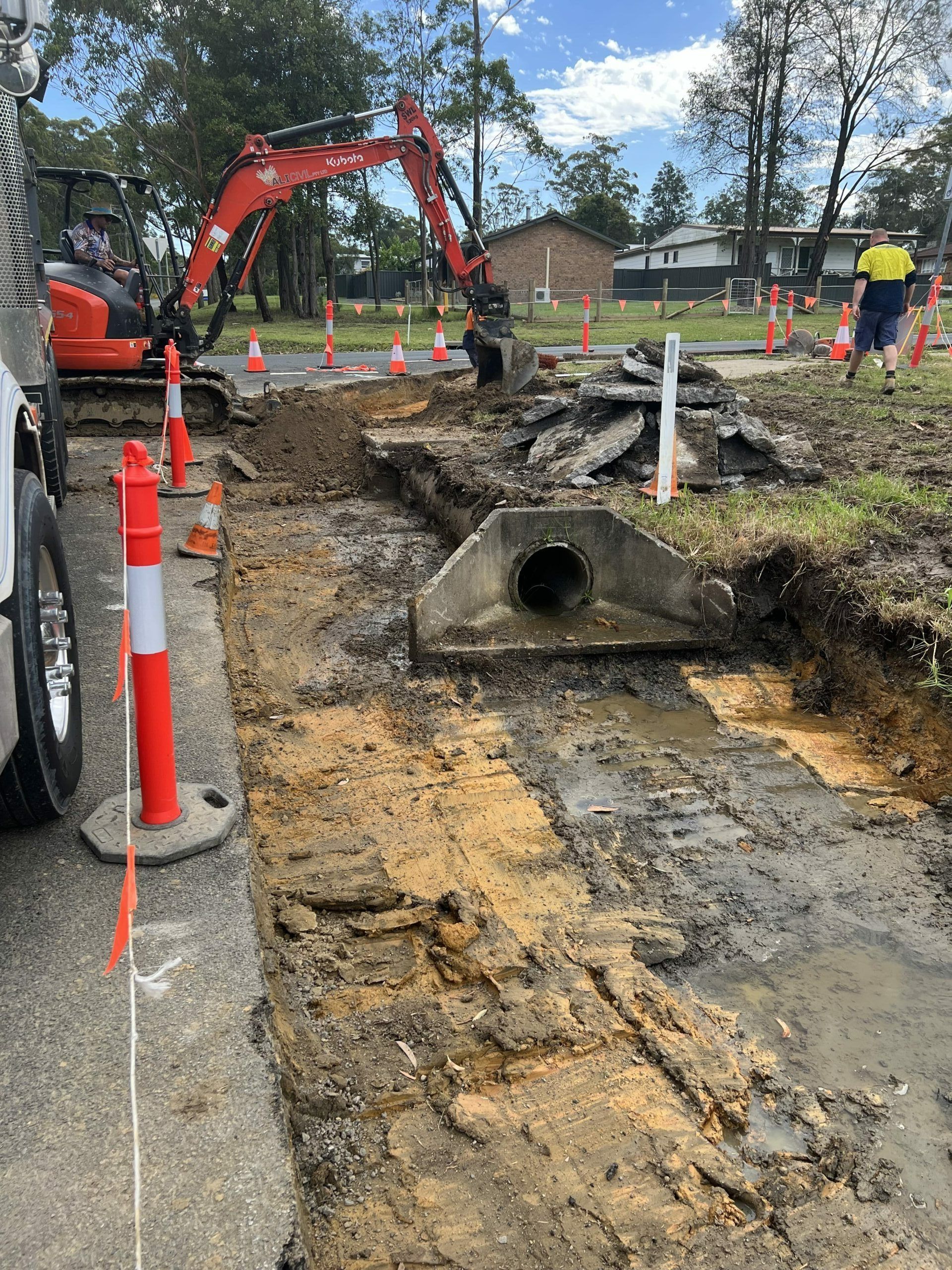Construction Site with Excavator, Orange Cones — ALI Civil Pty Ltd in South Nowra, NSW