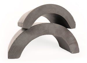 Two pieces of foam are stacked on top of each other on a white surface.