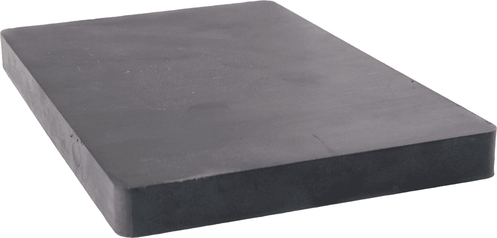 A black rectangular piece of foam is sitting on a white surface.