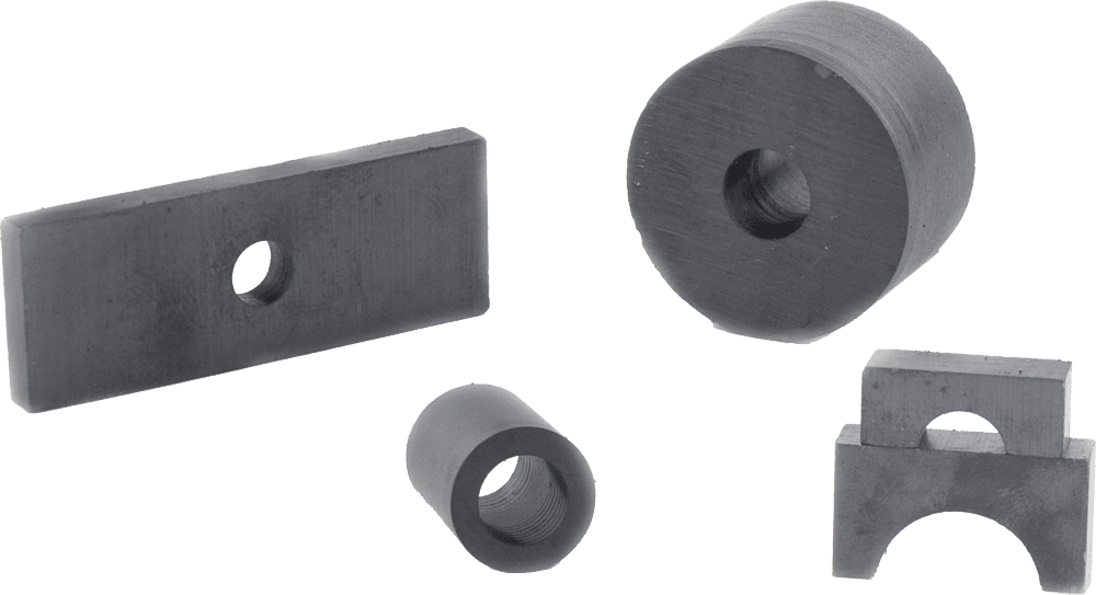 A bunch of black rubber pieces with holes in them