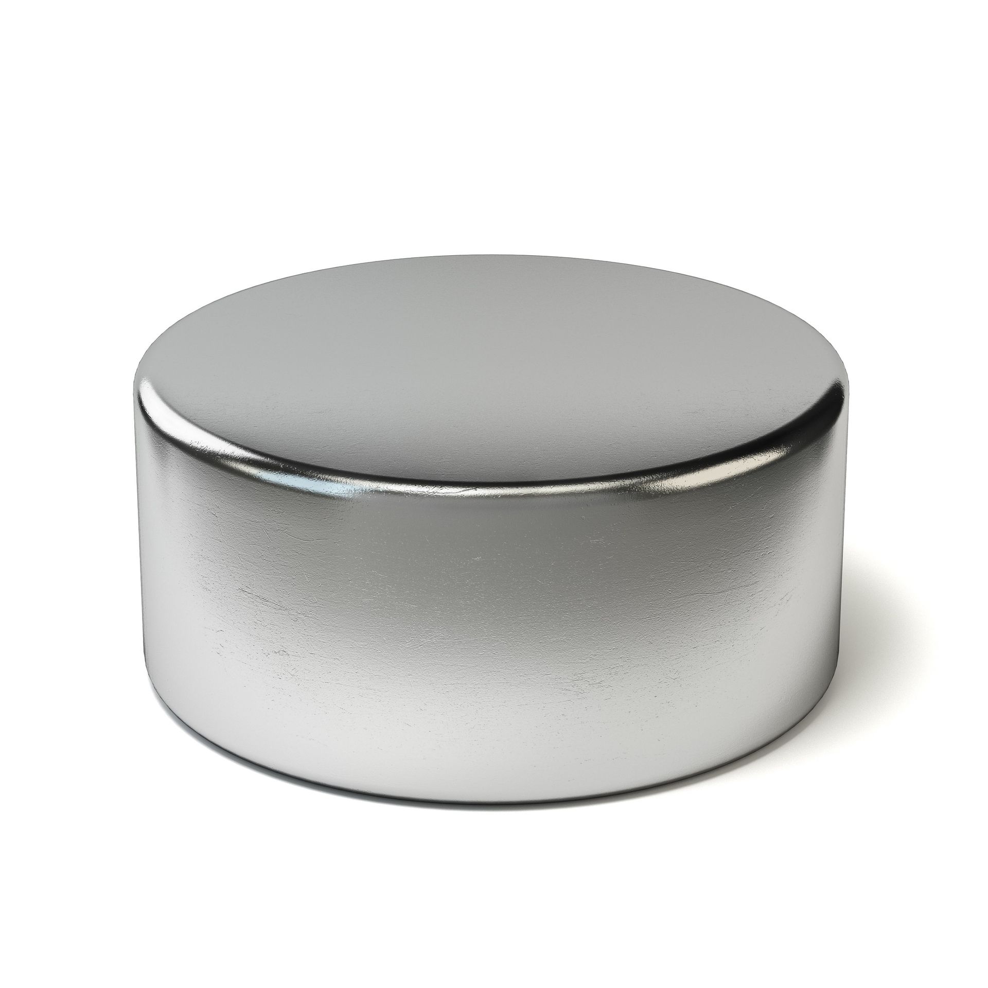 A silver metal object is sitting on a white surface
