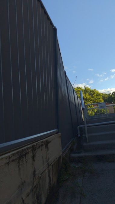 A Fence With Stairs Leading Up To It And A Blue Sky In The Background — AAA Fencing & Supplies in Southport, QLD