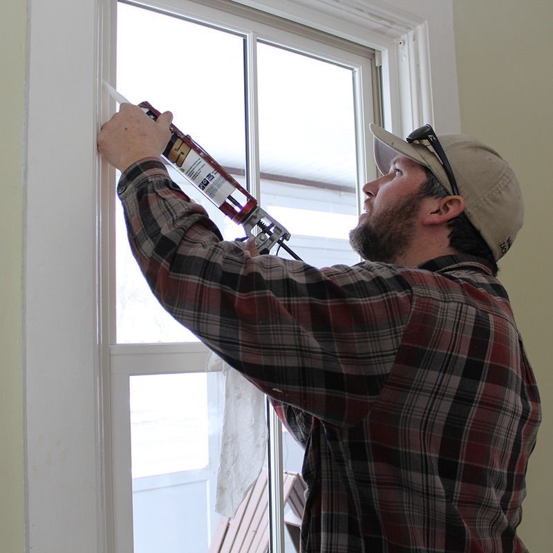 caulking gun to seal window frame