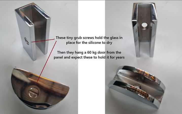 Close-up of a glass clamp with a locking pin, shown side view on a gray background.