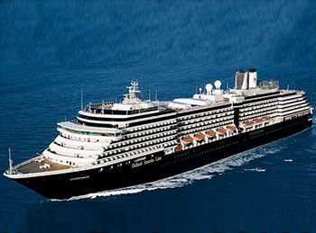 A large cruise ship is floating on top of a body of water.