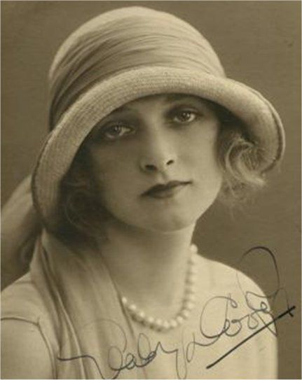 A photo of Gladys 'Flapper style' with an original autograph. - www.gladyscooper.com