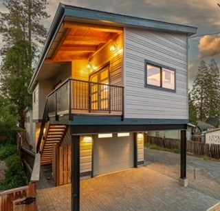 A small house with a balcony on top of it