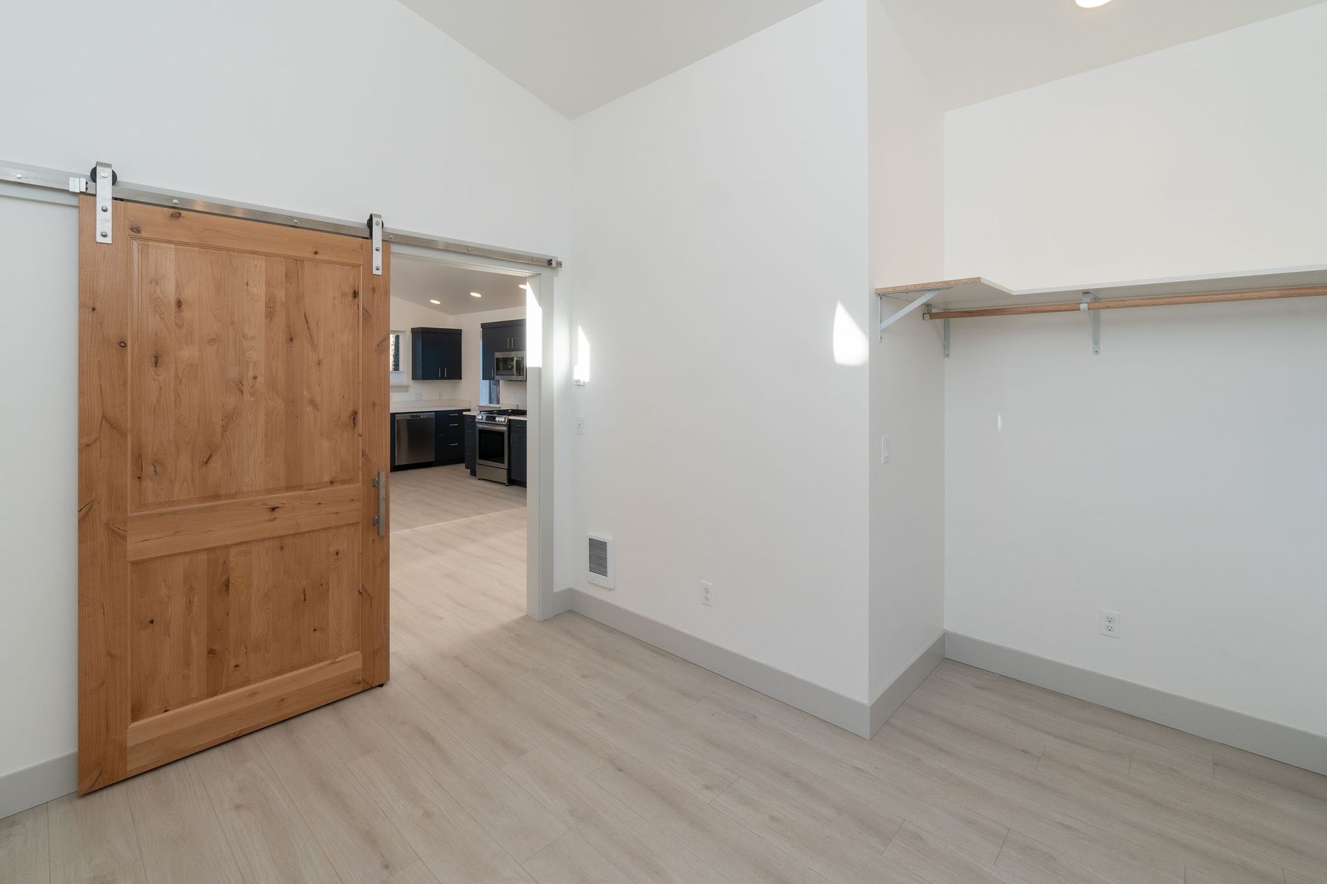 There is a sliding barn door in the closet.