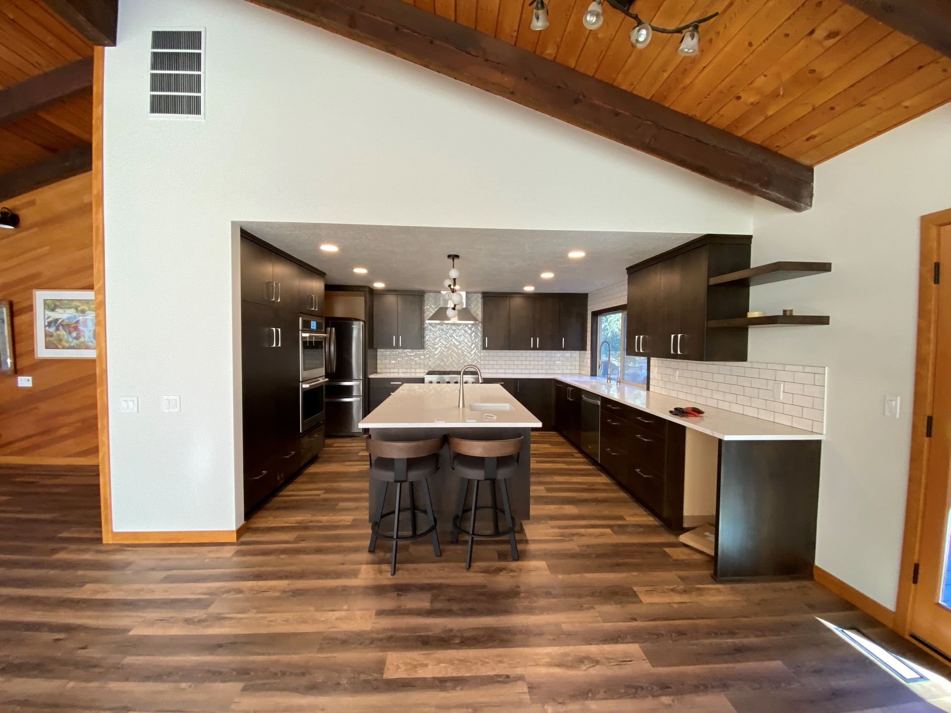 A kitchen with a large island in the middle of the room.