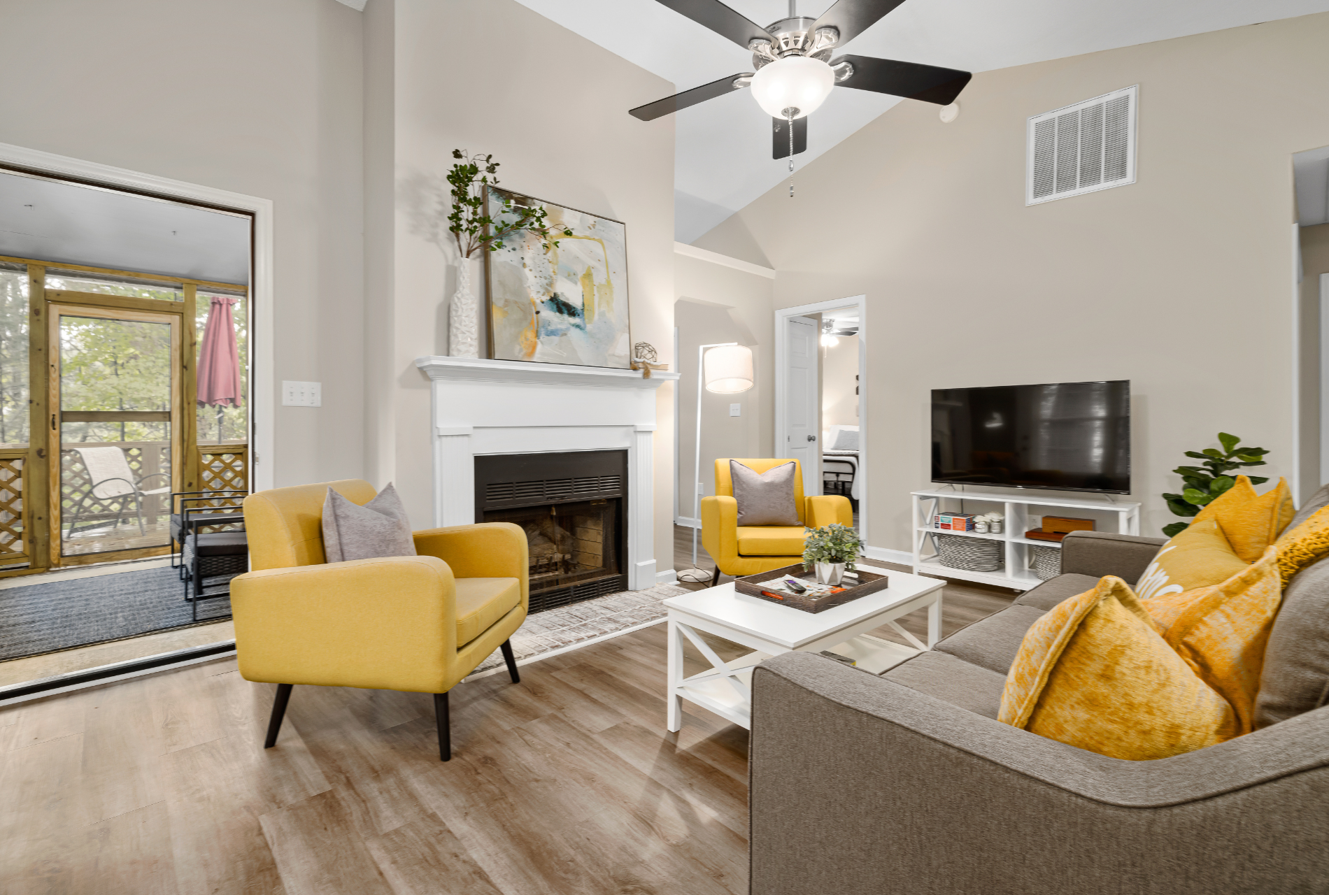 A living room filled with furniture and a fireplace.