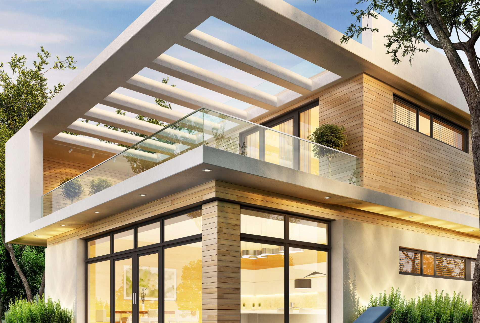 A modern house with a lot of windows and a balcony.