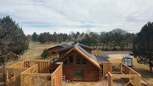 An aerial view of a log cabin under construction