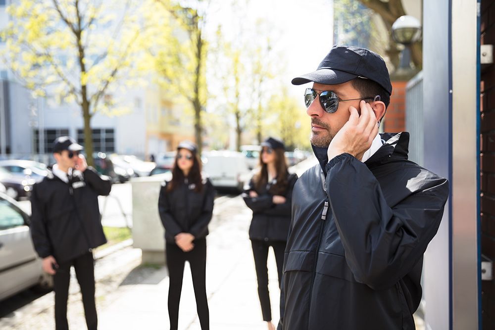 Close up Of A Young Male Security Guard Listening With Earpiece - Security Company in Dubbo, NSW