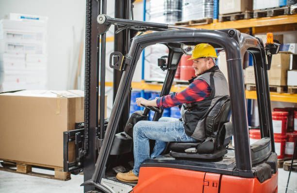 Warehouse specialist operating a high-capacity rental forklift for efficient freight management.