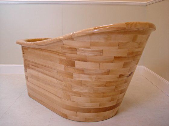 A wooden chair is sitting on a white floor