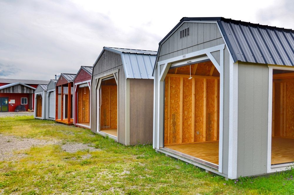 Line of Colorful Storage Sheds With Open Doorways — ShedBoss in Atherton, QLD