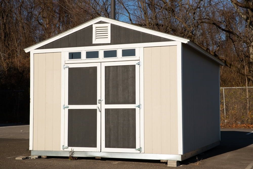 Tan and Gray Storage Shed With Double Doors, Ventilation, and Window — ShedBoss in Yungaburra, QLD 