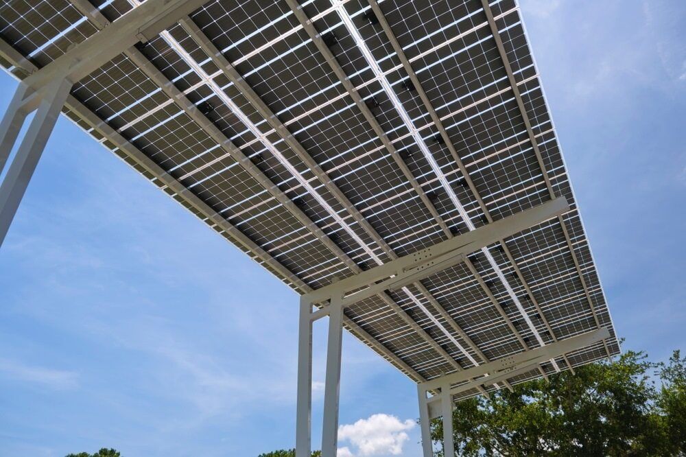 Solar Panels on a White Metal Structure, Against a Blue Sky With Some Clouds — ShedBoss in Tolga, QLD
