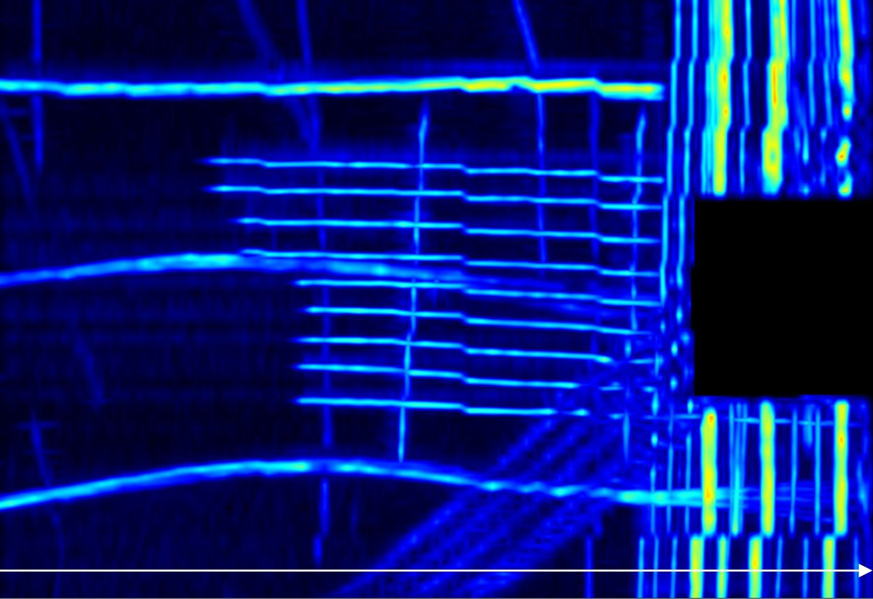 Blue and white spectrogram of sound waves, showing frequency and amplitude over time, with horizontal and vertical lines.