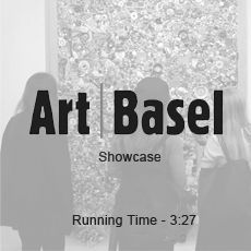 A black and white photo of people looking at a painting.