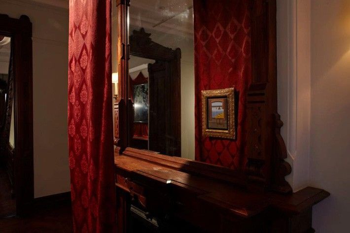 GALLERY ONE - [reflected in fireplace mantel mirror] René MAGRITTE “La Condition Humaine” 1935