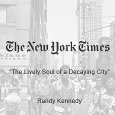 A black and white photo of a crowd of people walking down a city street.