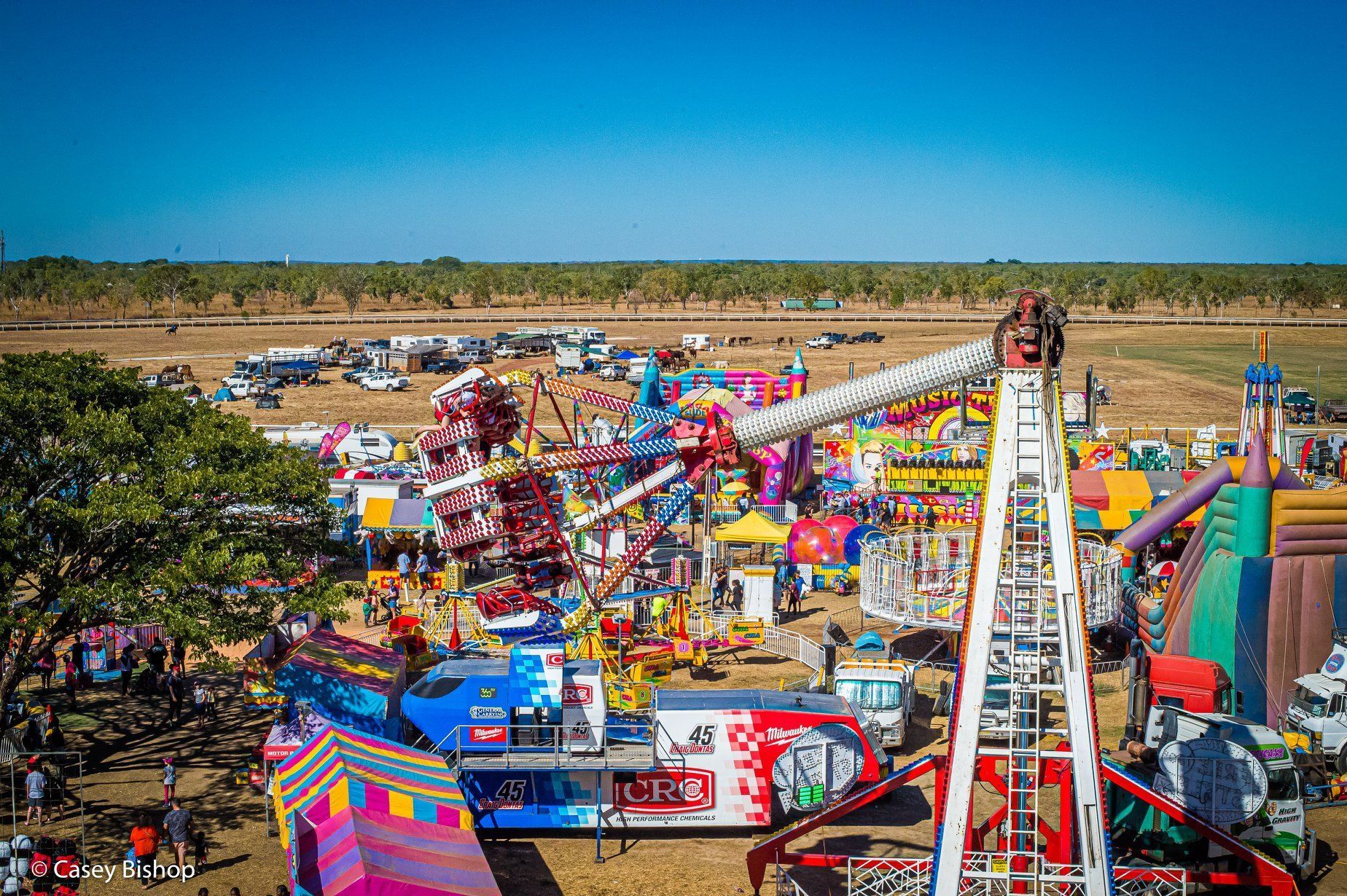 An aerial view of a carnival with a lot of rides.