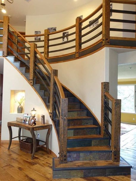 a room with a table and a stair case