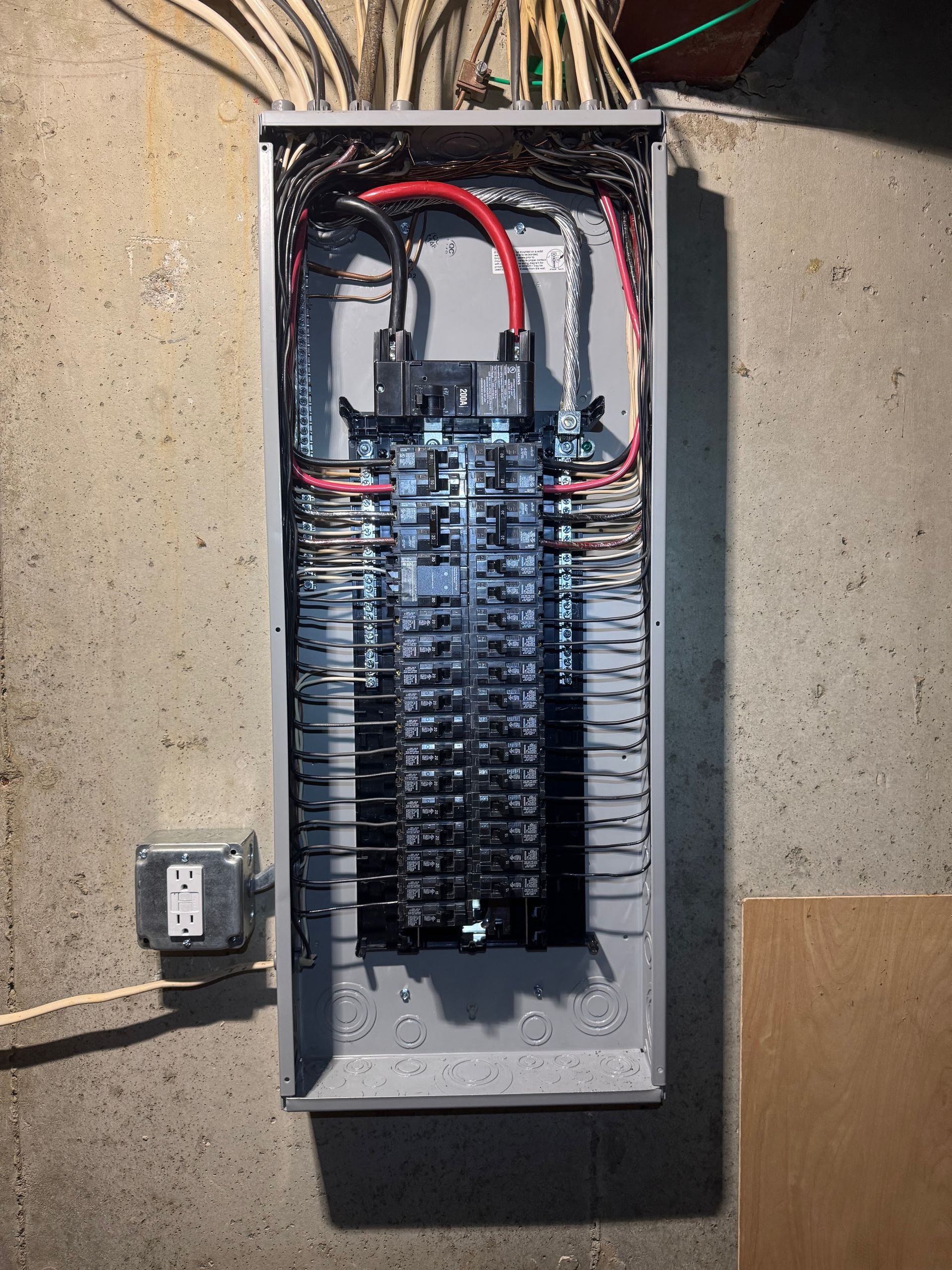 An electrical box with a lot of wires coming out of it
