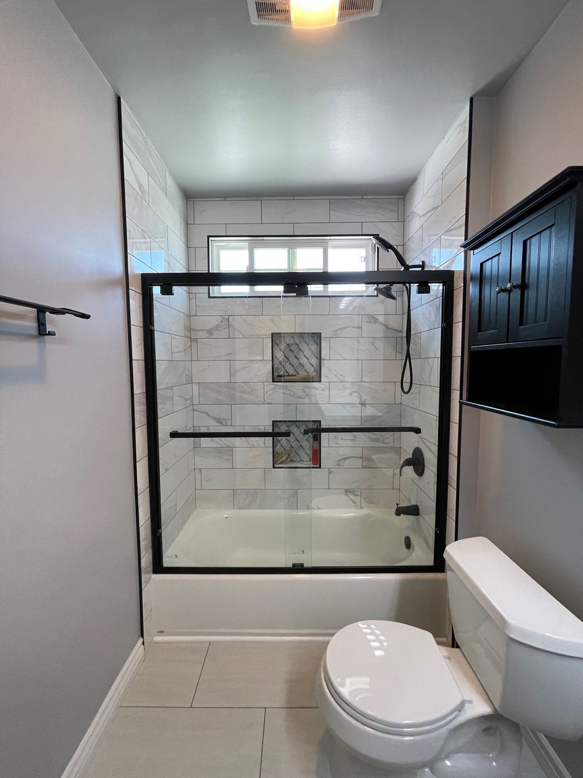 Architectural blueprints and tablet displaying floor plan.