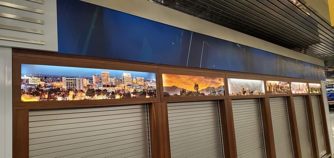 A row of shutters with a picture of a city on them.