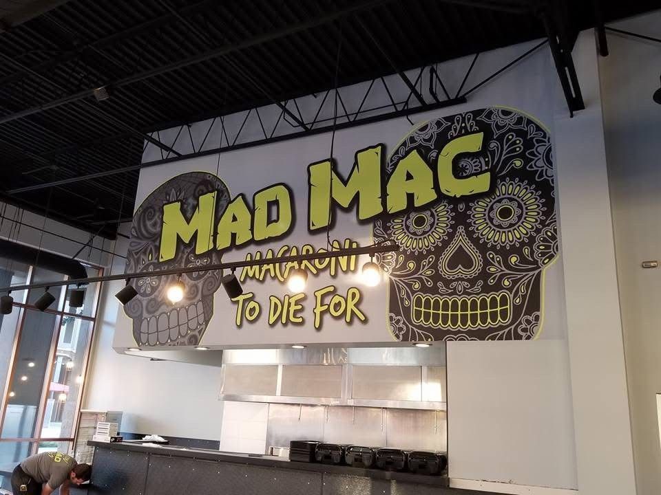 A kitchen with a sign that says mad mac to die for