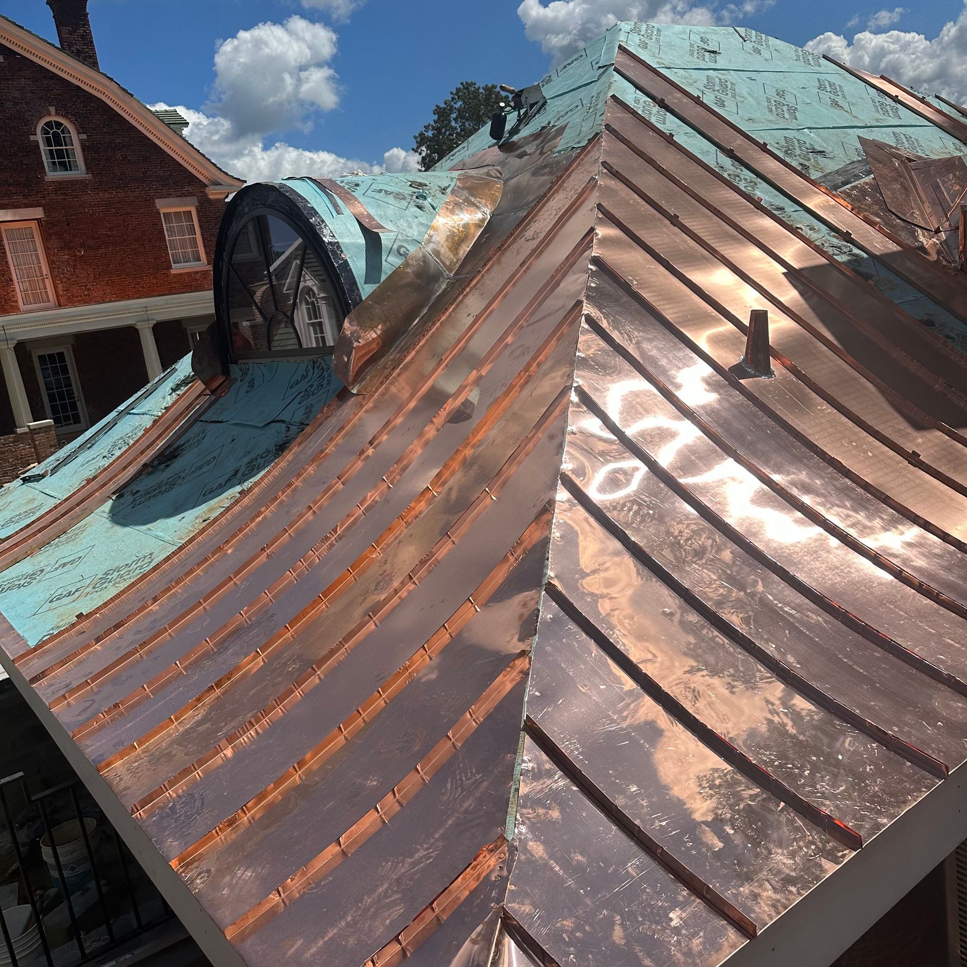 a copper roof is being installed on a house
