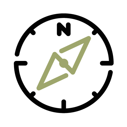 A compass with a green arrow pointing to the north.