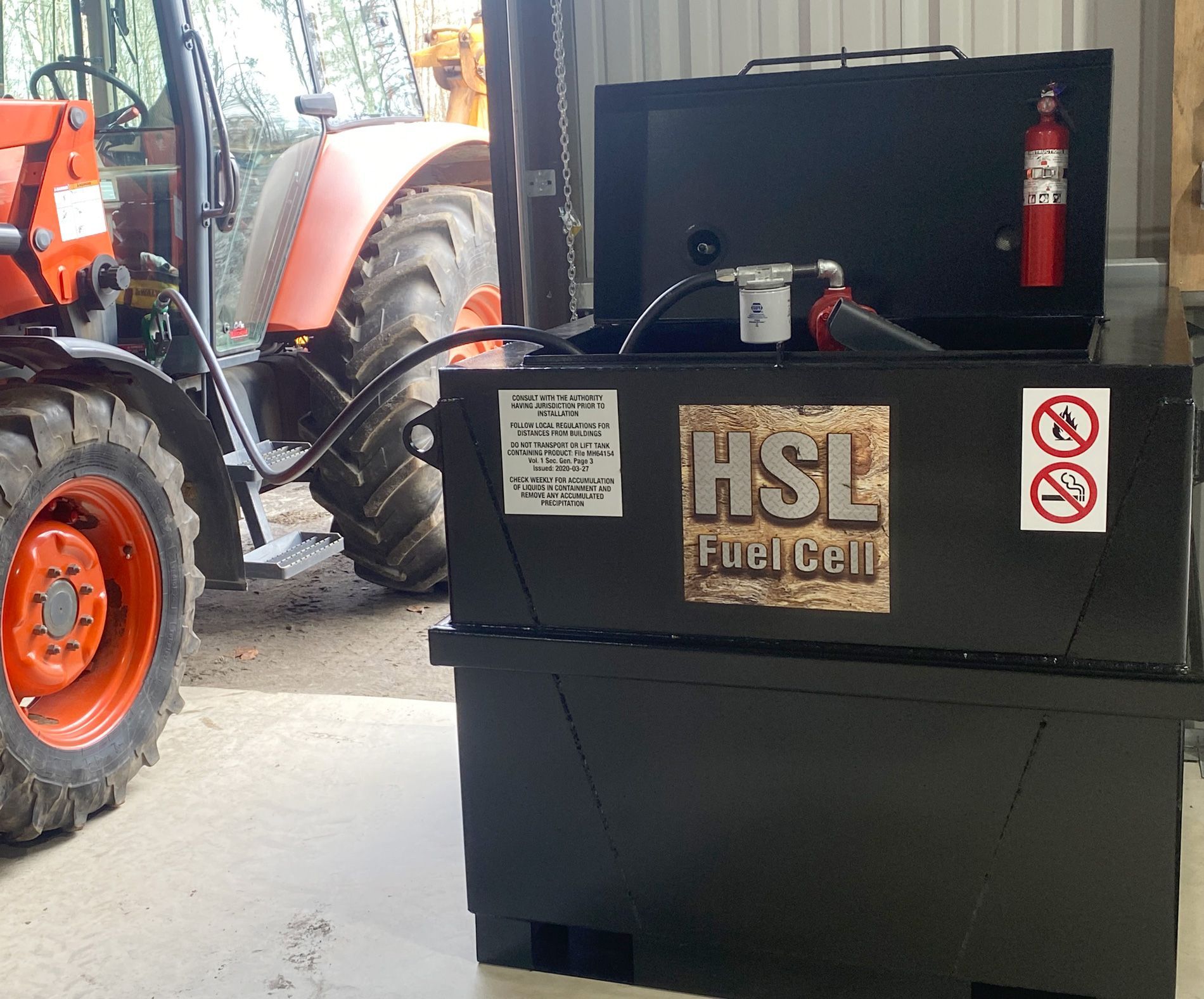 A hsl fuel cell is sitting in front of a tractor