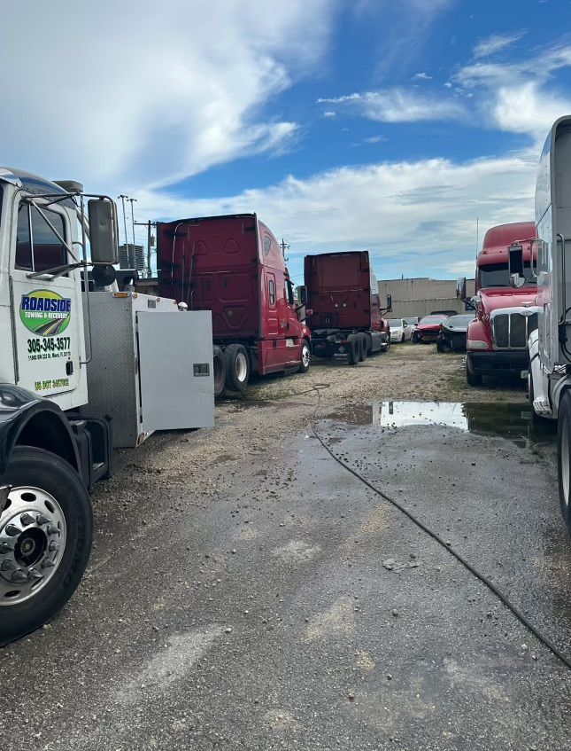 Heavy-duty truck yard in Miami – semi-truck recovery and towing services with roadside assistance support.