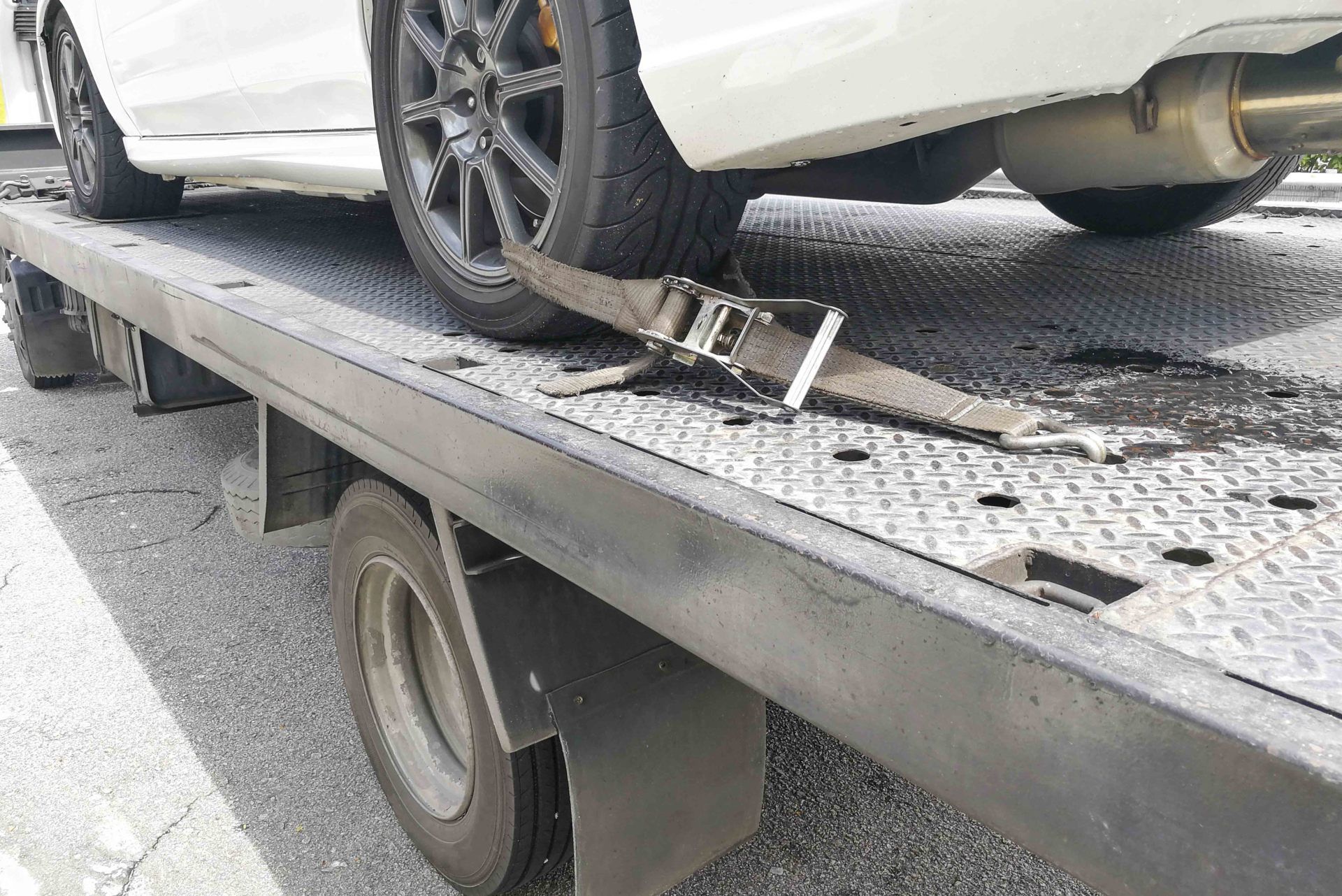 Recovery — Car Tire Secured With Safety Belt in Akron, OH