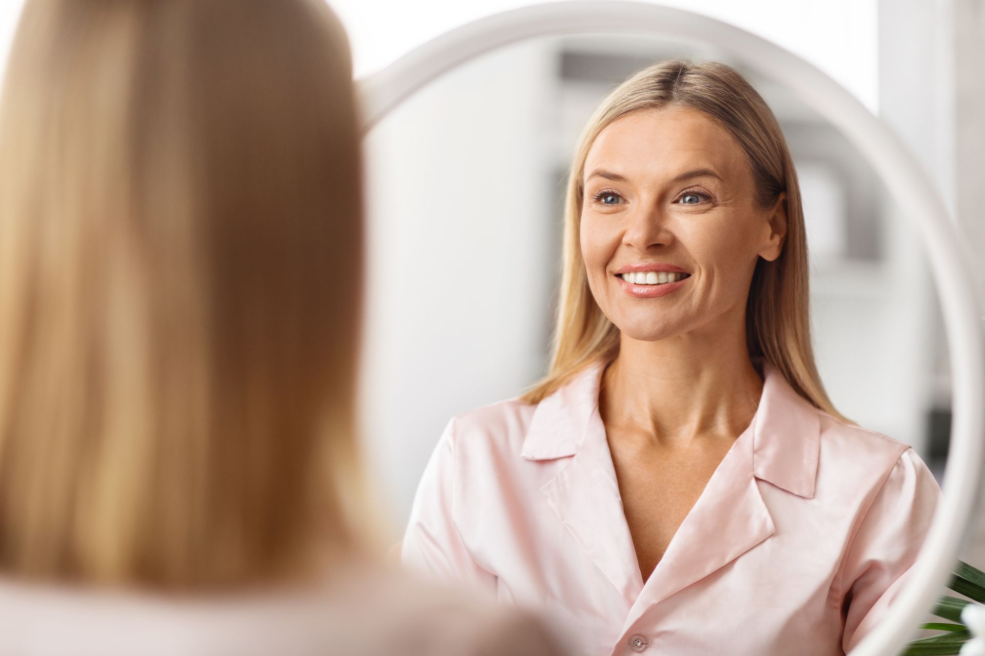 Woman smiling during a consultation with a professional in a bright room