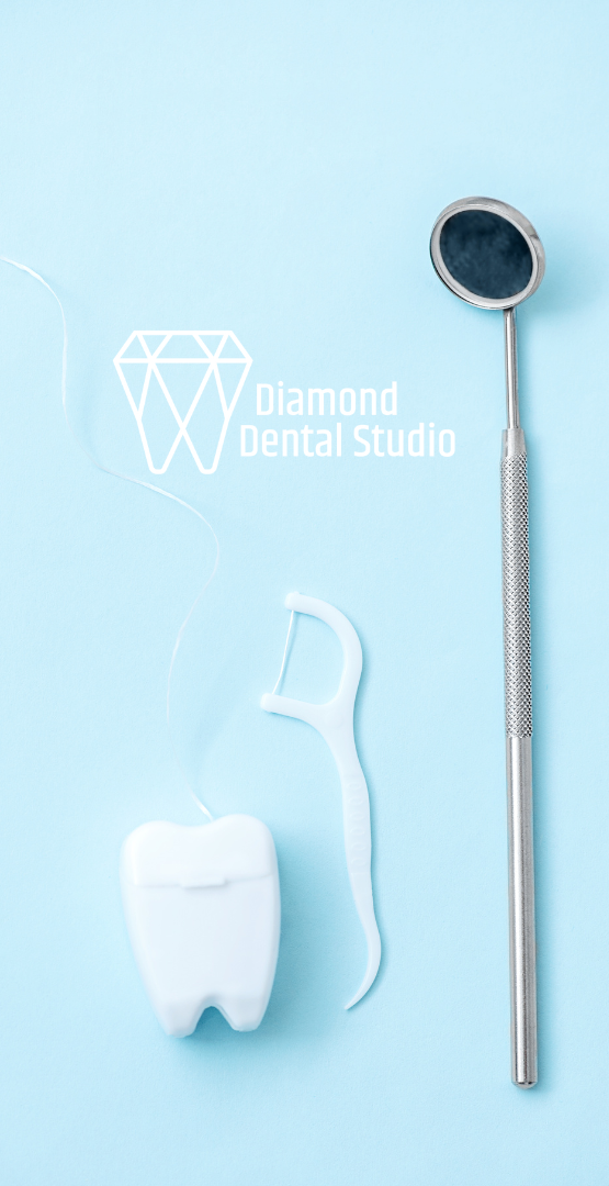 A tooth , floss , mirror and dental mirror on a blue background.