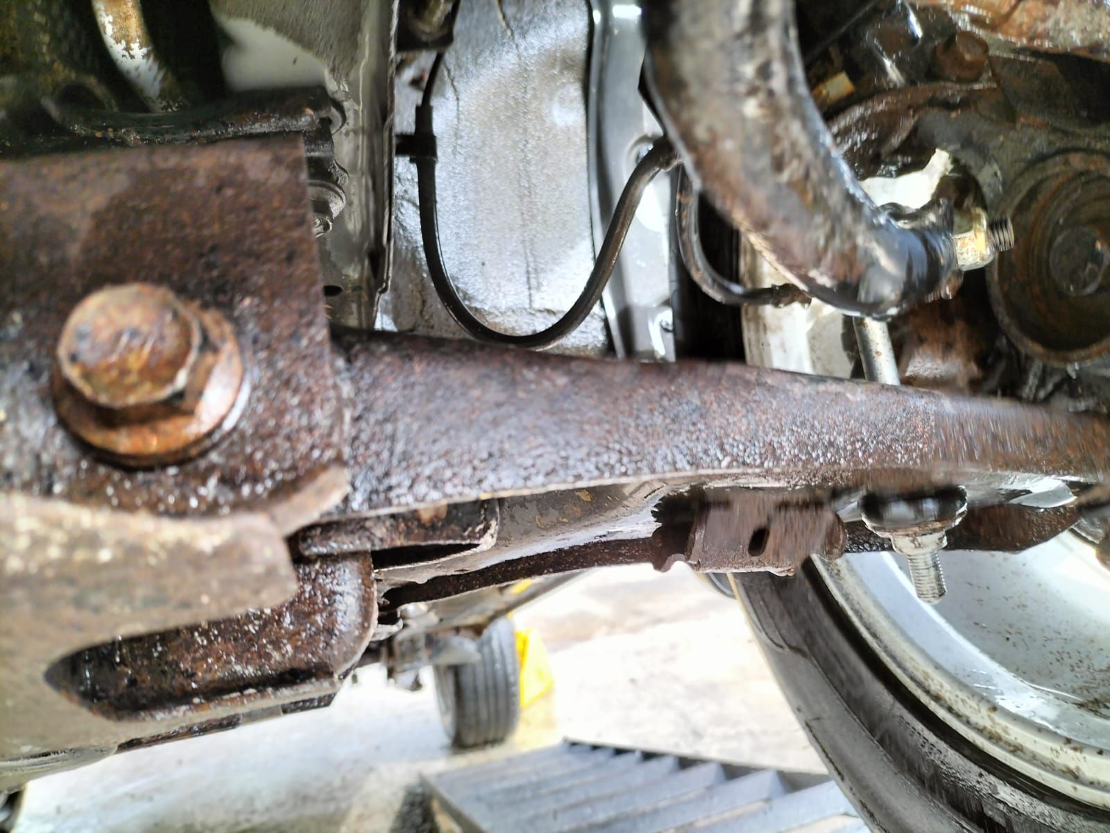 A close up of a rusty piece of metal on a car. Prevent this by sending your vehicle to Anthony Anti-Corrosion Coatings.