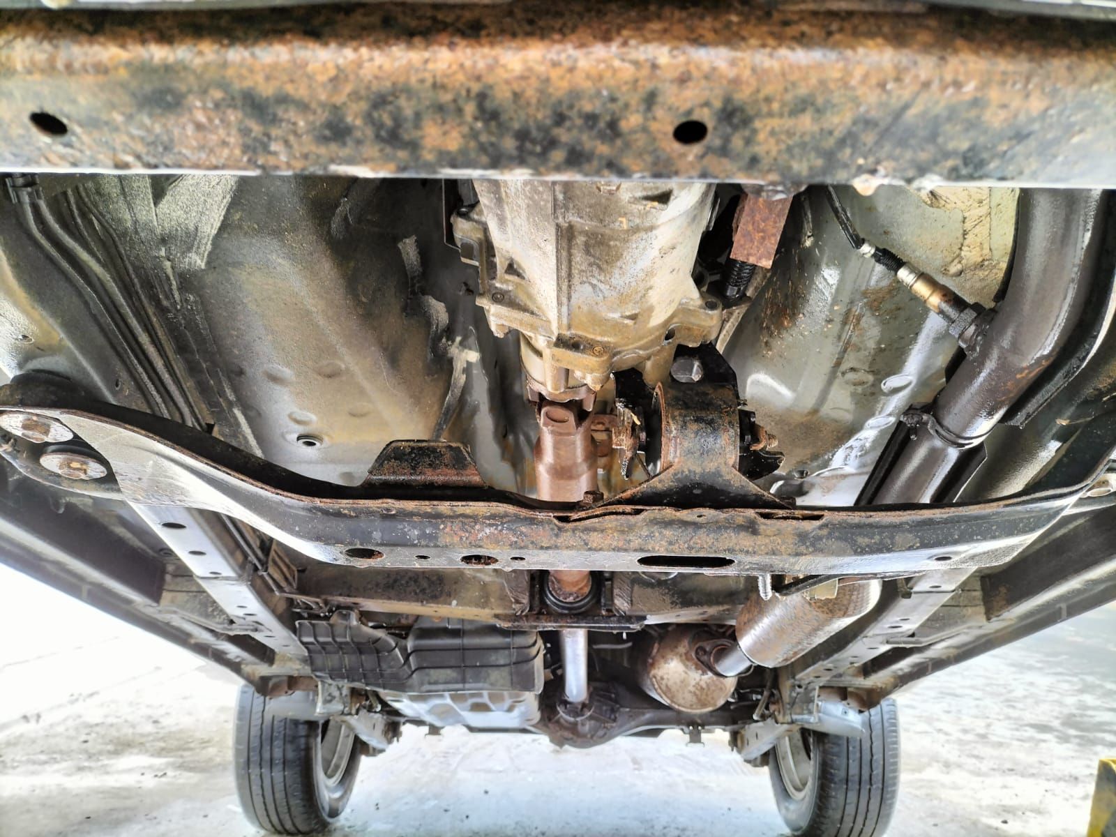 A close up of the underside of a car. Prevent this by sending your vehicle to Anthony Anti-Corrosion Coatings.