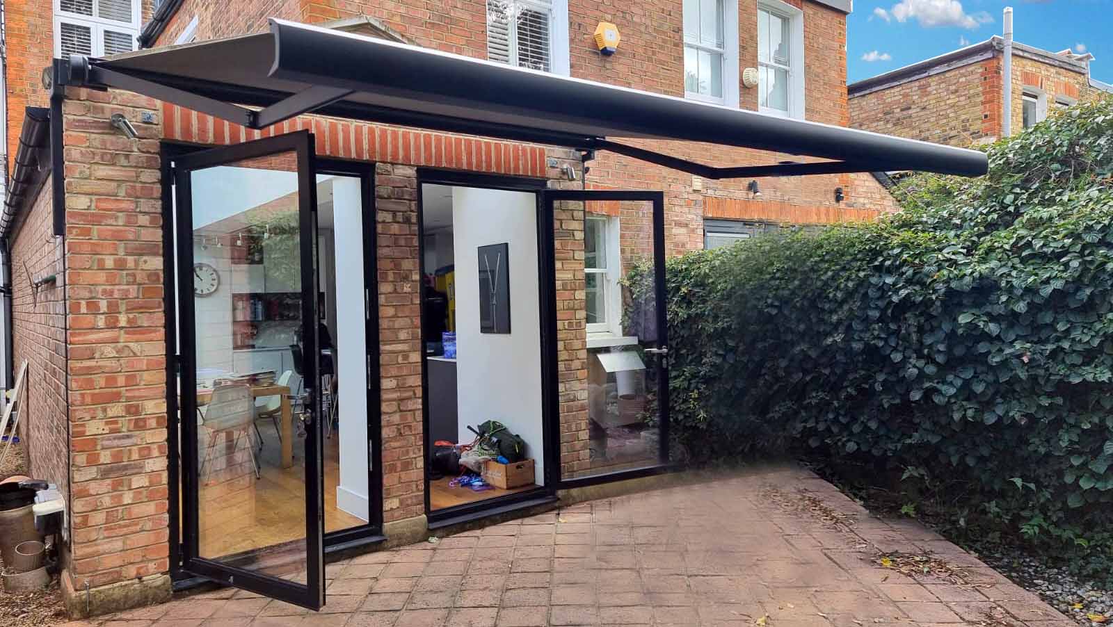 A close-up of a motorised retractable awning, showing the durable fabric and sleek design.