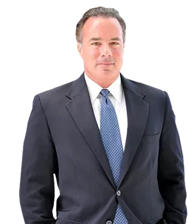 Professional headshot of a person wearing a dark suit, white shirt, and blue patterned tie, centered on a white background.