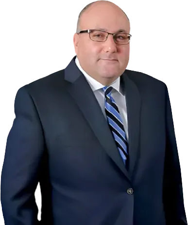A person wearing glasses, a dark blue suit, white shirt, and blue striped tie against a white background.