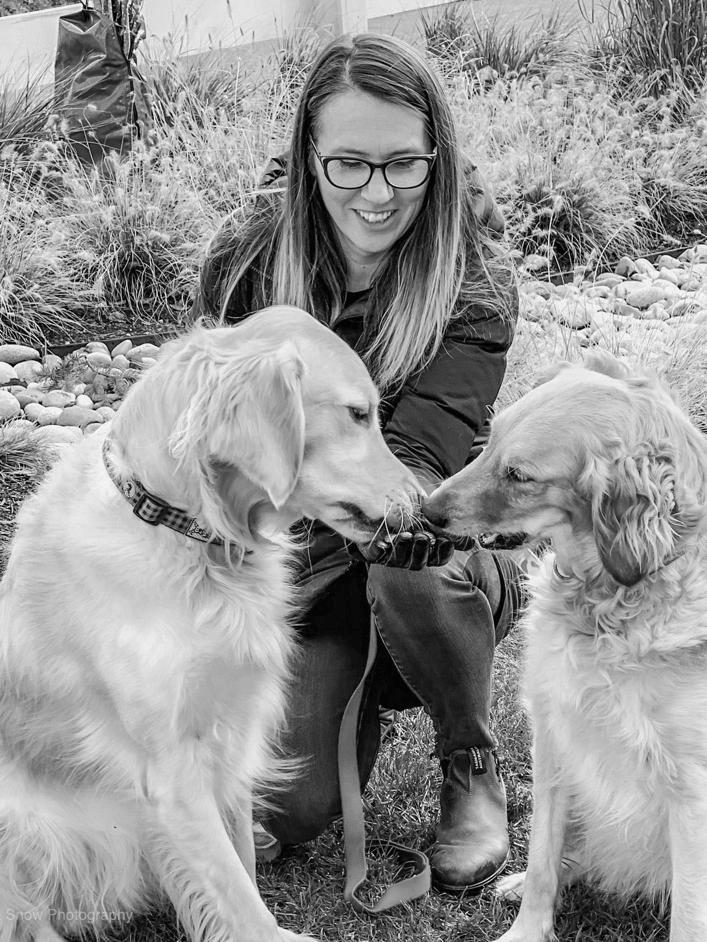 Trisha Snow with two dogs of her dogs,       Lucy and Ashy