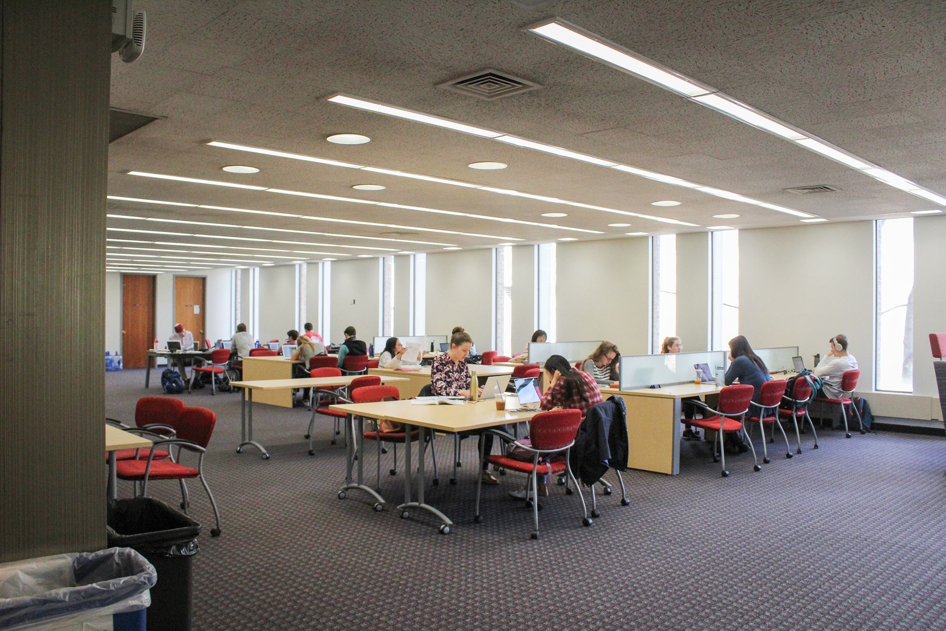 students studying in a college library 